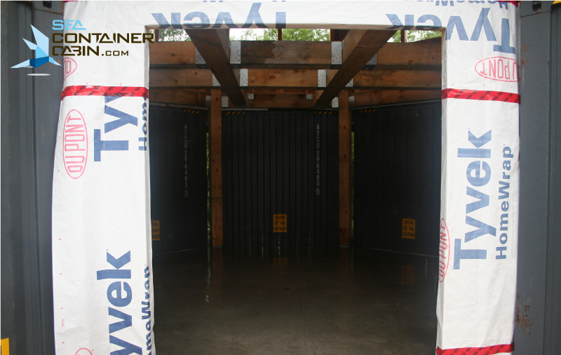 Shipping-Container-Cabin-Front-Entrance-Overlooking-Great-Room-Workbench